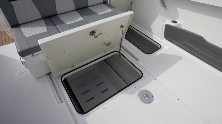Large under sole storage compartments and cockpit side pockets that may accommodate even deck folding chairs